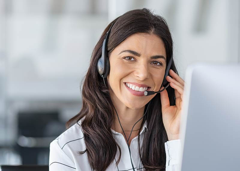 Smiling Woman With a Headset